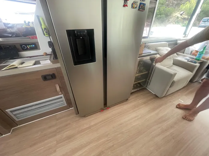  Yacht Photos Pics Modern kitchen interior on a Bali 5.4 yacht, featuring a stainless steel refrigerator.