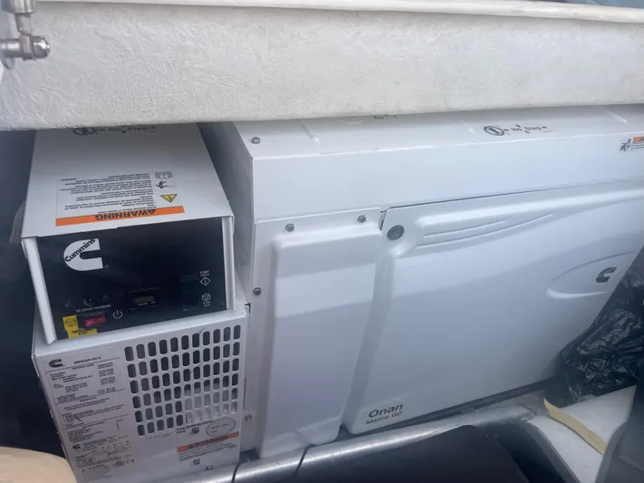  Yacht Photos Pics Cummins Onan marine generator in a 2023 Bali 5.4 yacht engine compartment.