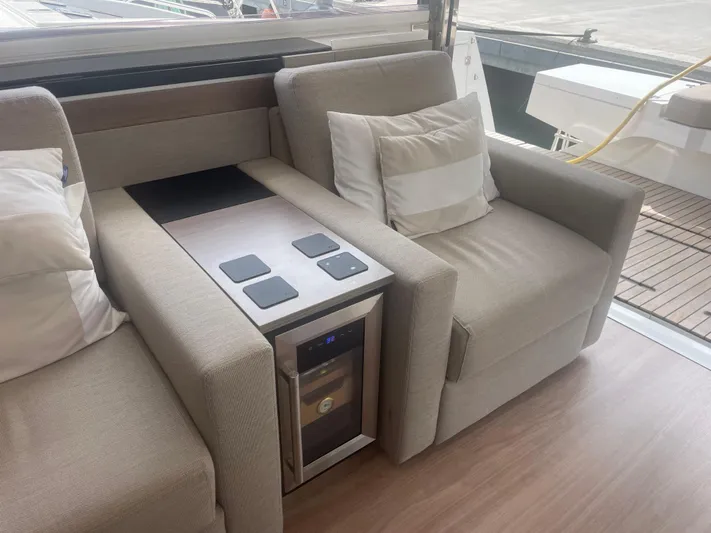  Yacht Photos Pics Luxurious seating area on 2023 Bali 5.4 yacht with integrated mini fridge.