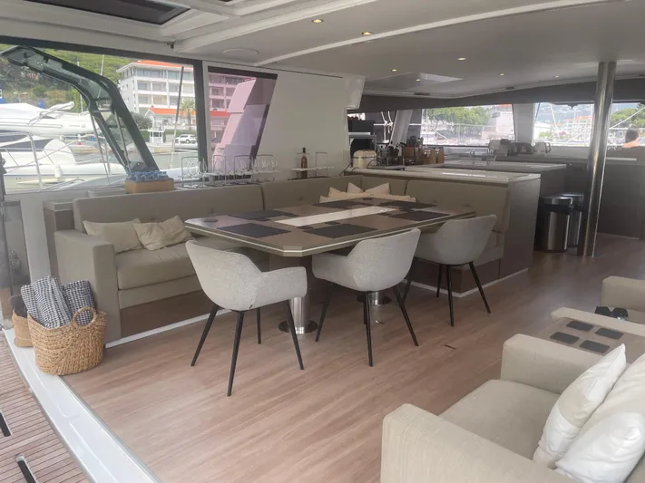  Yacht Photos Pics Luxurious interior of 2023 Bali 5.4 yacht with elegant dining area and modern furnishings.