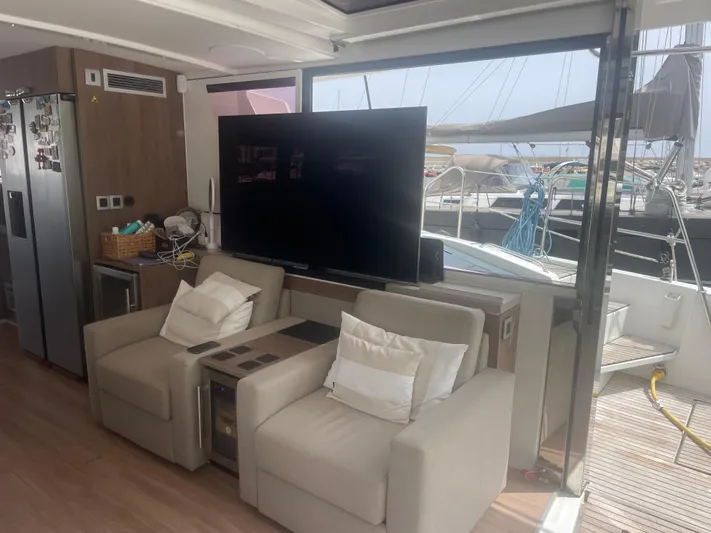  Yacht Photos Pics Luxurious interior of a 2023 Bali 5.4 yacht with comfortable seating and large TV.