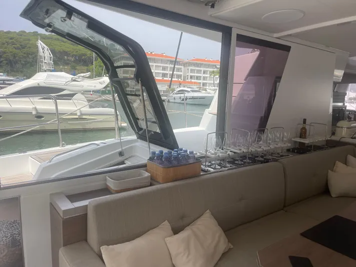  Yacht Photos Pics Interior of a 2023 Bali 5.4 yacht with elegant seating and glassware setup.