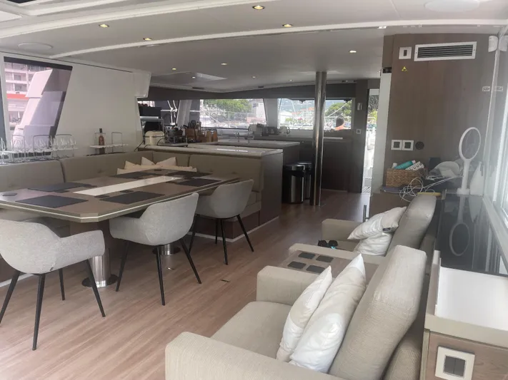  Yacht Photos Pics Luxurious interior of 2023 Bali 5.4 yacht with modern dining and seating area.