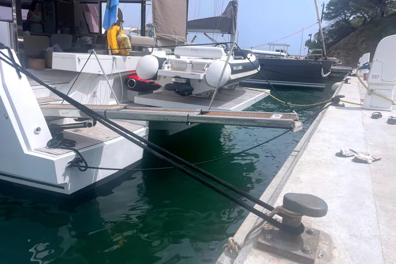  Yacht Photos Pics Docked Bali 5.4 yacht with tender, 2023 model, moored at marina.