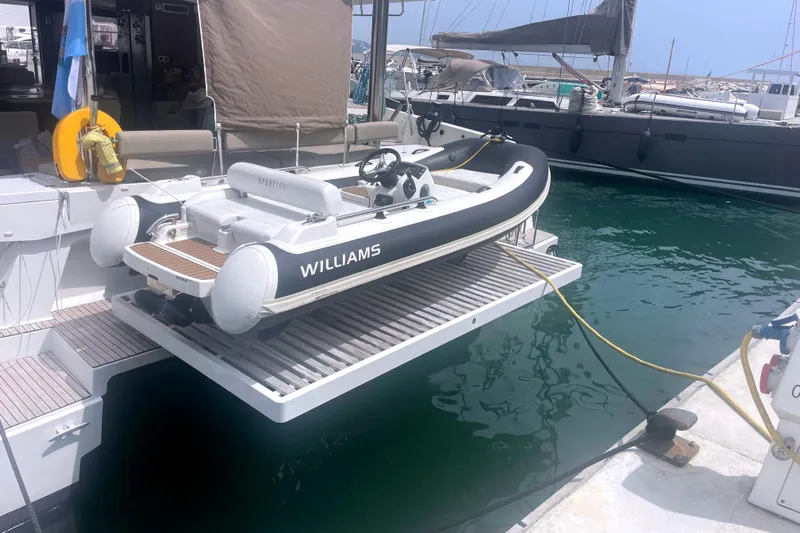  Yacht Photos Pics A 2023 Bali 5.4 yacht with a Williams tender docked at a marina.