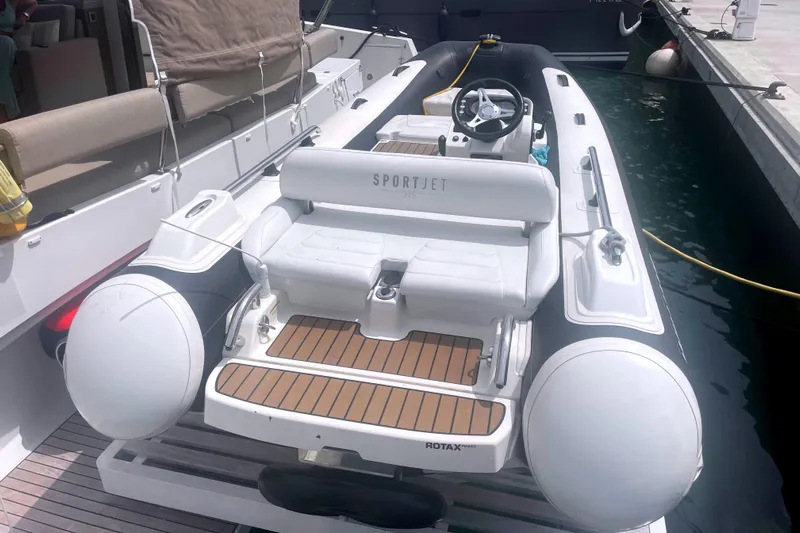  Yacht Photos Pics Inflatable boat docked, featuring a Bali 5.4 model, 2023, with SportJet branding.