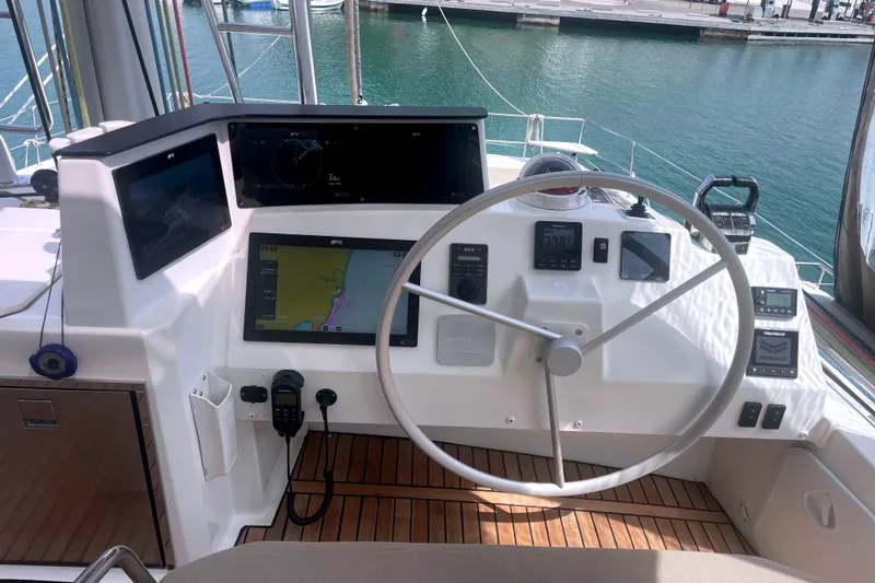  Yacht Photos Pics Helm of 2023 Bali 5.4 yacht with navigation screens and steering wheel.
