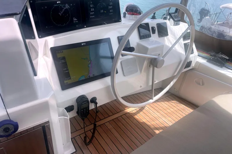  Yacht Photos Pics Helm of 2023 Bali 5.4 yacht with navigation screens and steering wheel.