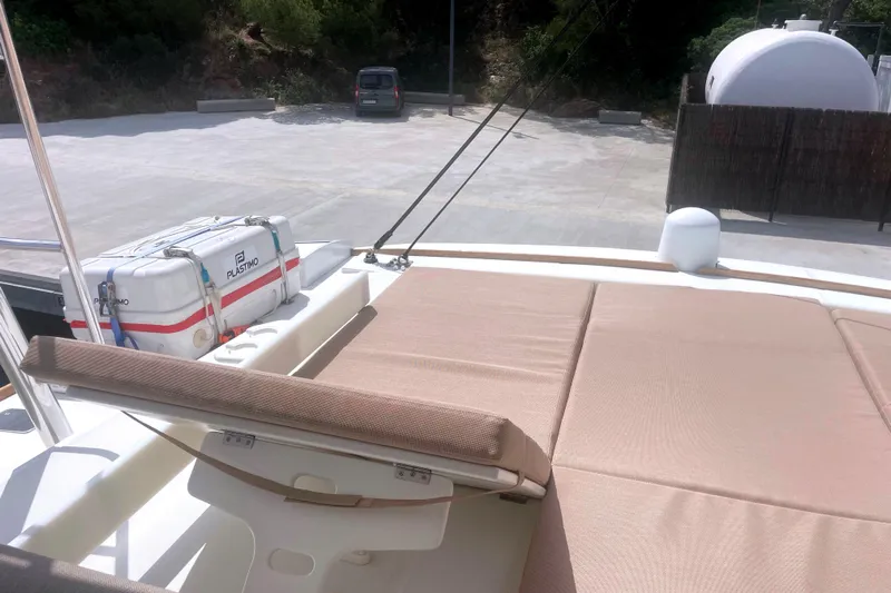  Yacht Photos Pics Deck of 2023 Bali 5.4 yacht with sunbathing area and safety equipment.