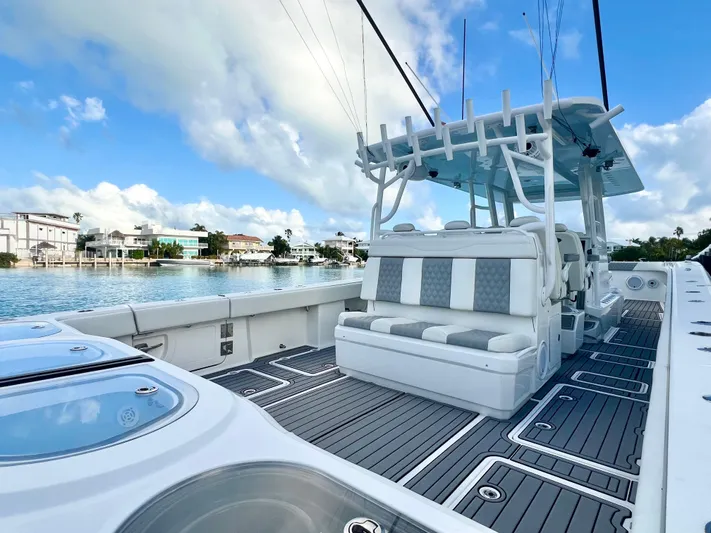 Lia Rose Yacht Photos Pics Invincible 46 Catamaran 2022 on serene water, showcasing spacious deck and seating.