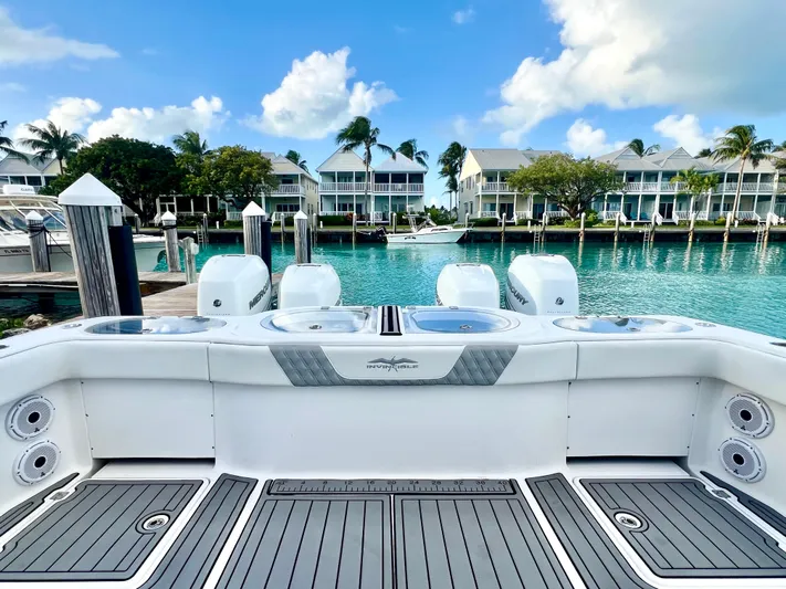 Lia Rose Yacht Photos Pics Invincible 46 Catamaran 2022 docked in a scenic marina with waterfront homes.