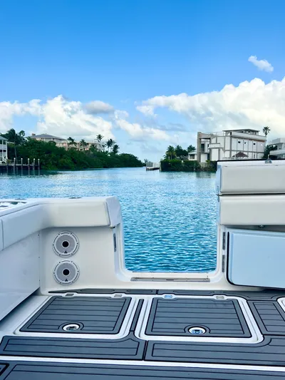 Lia Rose Yacht Photos Pics Invincible 46 Catamaran 2022 on serene water with clear blue sky.