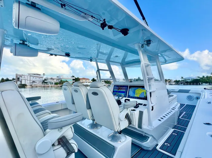 Lia Rose Yacht Photos Pics Luxurious 2022 Invincible 46 Catamaran interior with advanced navigation systems and plush seating.