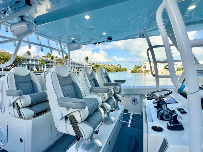 Lia Rose Yacht Photos Pics Luxurious 2022 Invincible 46 Catamaran interior with plush seating and modern controls.