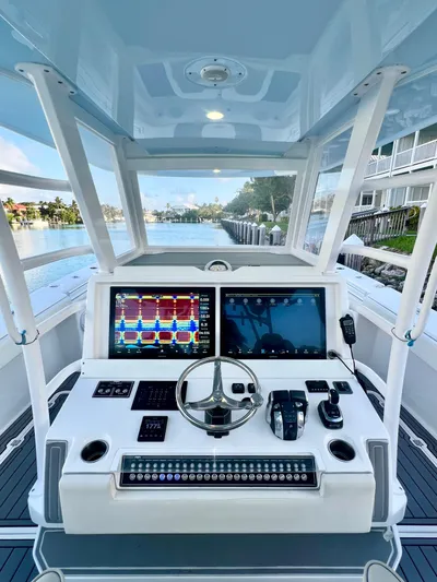 Lia Rose Yacht Photos Pics 2022 Invincible 46 Catamaran helm with advanced navigation displays and controls.