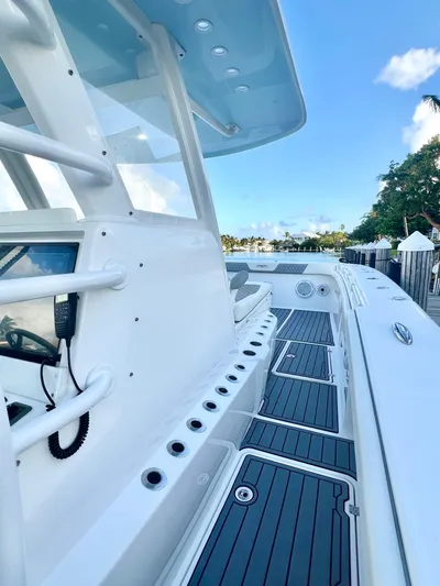 Lia Rose Yacht Photos Pics Invincible 46 Catamaran 2022, sleek deck design, clear blue sky background.