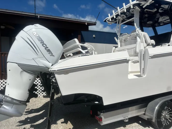  Yacht Photos Pics 2023 Fountain 38 CC boat with Mercury outboard engine on a trailer.