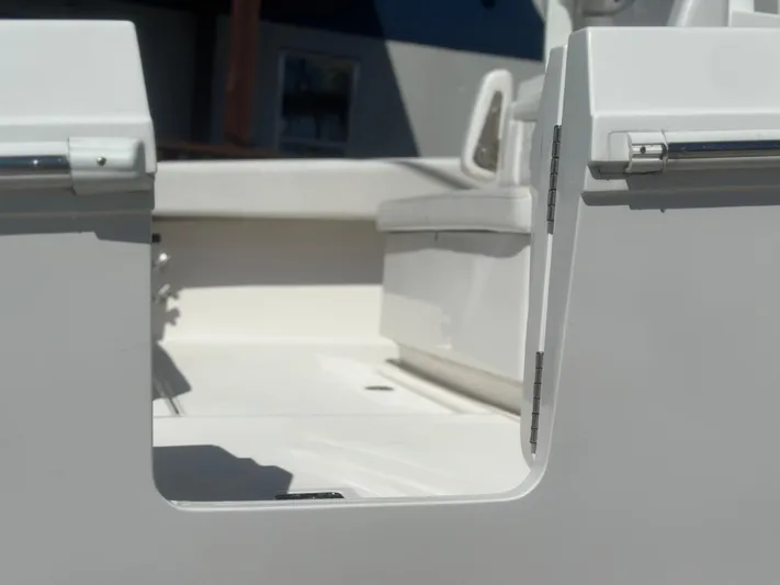  Yacht Photos Pics 2023 Fountain 38 CC boat interior, featuring sleek white seating and modern design.