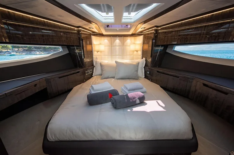  Yacht Photos Pics Luxurious 2023 Galeon 500 Fly yacht bedroom with ocean view and elegant decor.
