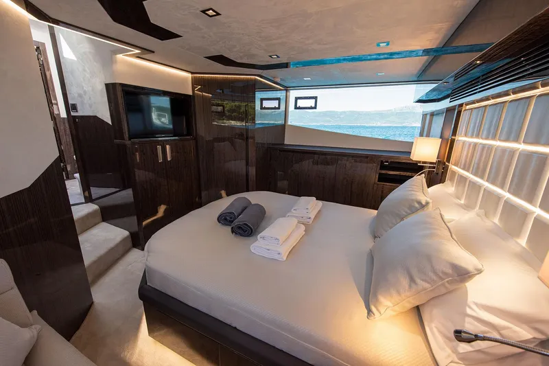  Yacht Photos Pics Luxurious bedroom interior of 2023 Galeon 500 Fly yacht with ocean view.