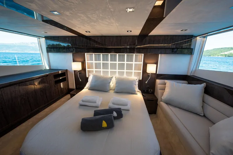  Yacht Photos Pics Luxurious bedroom interior of 2023 Galeon 500 Fly yacht with ocean view.