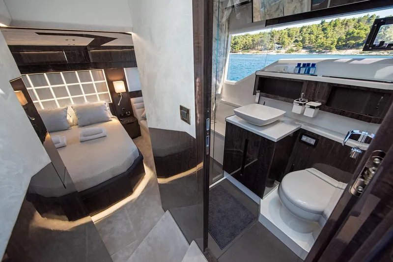  Yacht Photos Pics Luxurious interior of 2023 Galeon 500 Fly yacht featuring bedroom and bathroom.