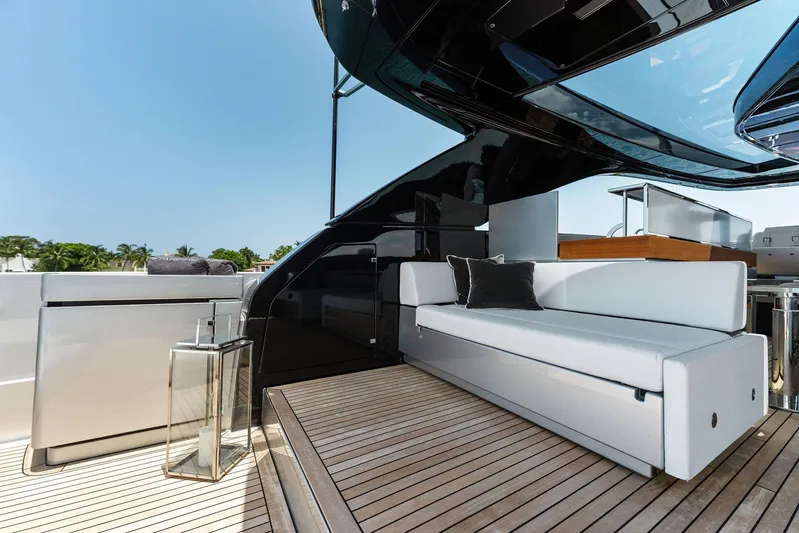 Chop Chop Yacht Photos Pics Luxurious 2023 Riva Dolcevita yacht deck with modern seating and sleek design.