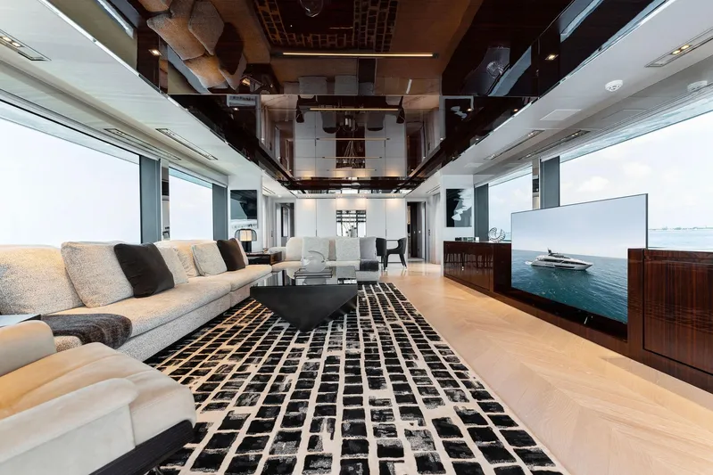 Chop Chop Yacht Photos Pics Luxurious interior of 2023 Riva Dolcevita yacht with modern decor and large windows.