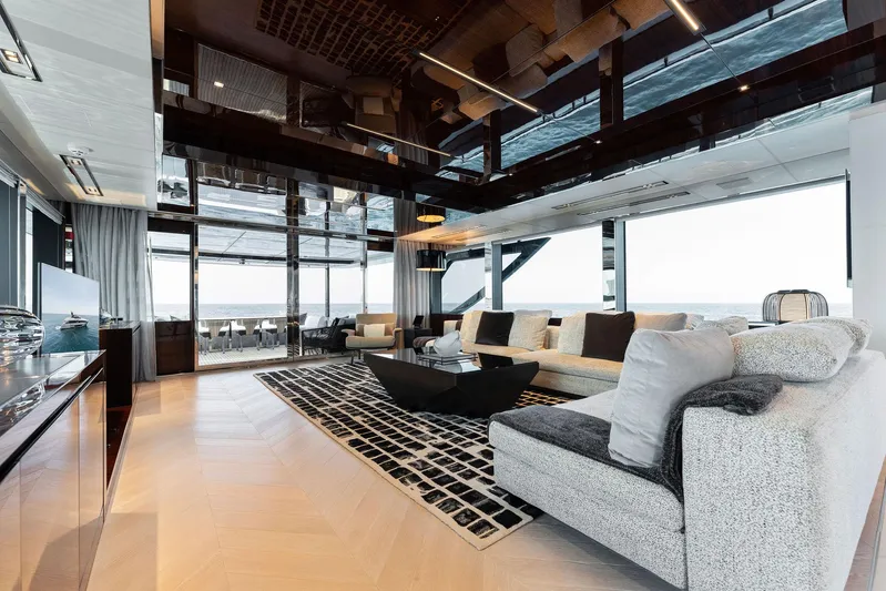 Chop Chop Yacht Photos Pics Luxurious interior of 2023 Riva Dolcevita yacht with modern furnishings and panoramic windows.