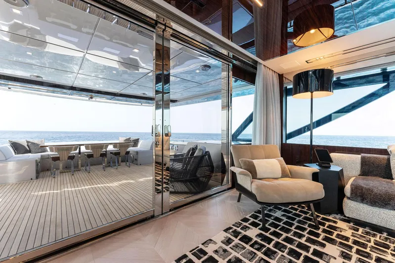 Chop Chop Yacht Photos Pics Luxurious 2023 Riva Dolcevita yacht interior with elegant seating and ocean view.