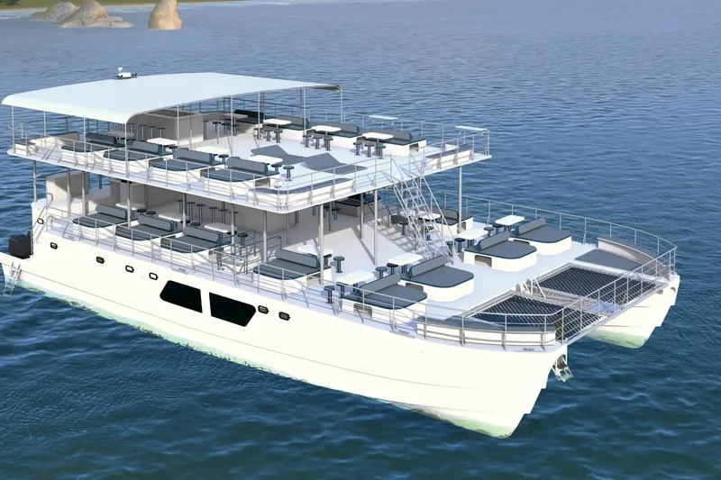  Yacht Photos Pics Luxurious 2027 Custom PAXCAT catamaran with multiple decks, cruising on serene blue waters.