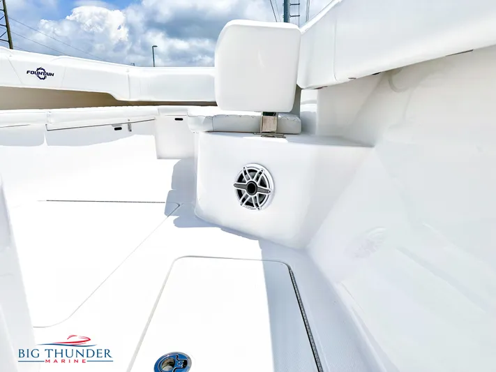  Yacht Photos Pics 2023 Fountain 38 CC boat interior with seating and speaker, Big Thunder Marine logo.