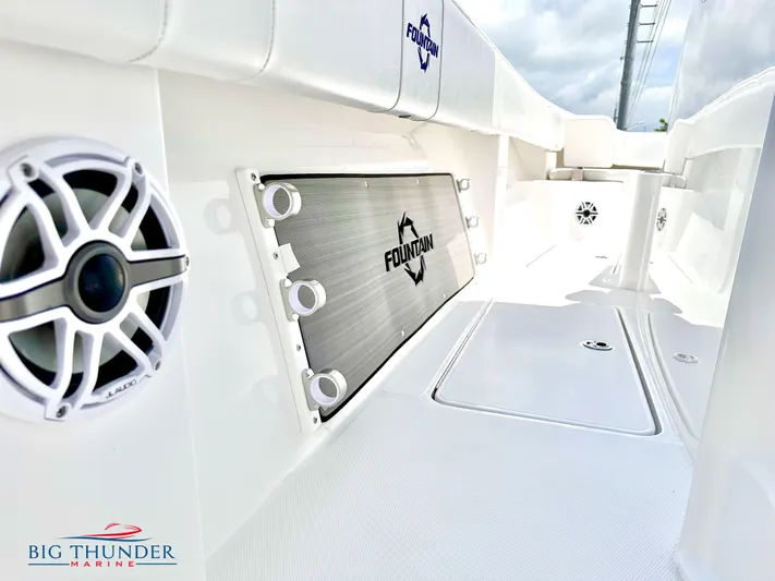  Yacht Photos Pics 2023 Fountain 38 CC boat interior with speaker and storage compartment.