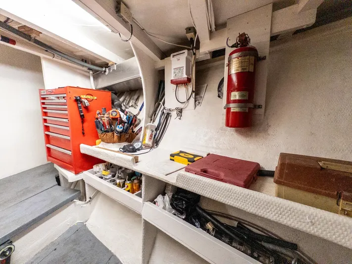 Starlight Yacht Photos Pics Workshop area on 1986 Custom Expedition Vessel 58 with tools, fire extinguisher, and storage shelves.