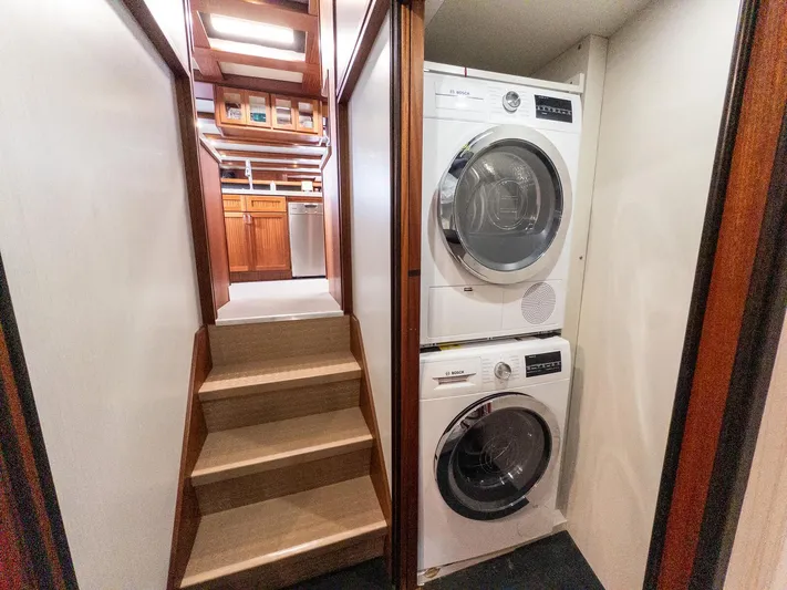 Starlight Yacht Photos Pics Laundry area with stacked washer and dryer in 1986 Custom Expedition Vessel 58.