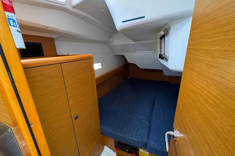 Layover Yacht Photos Pics Cozy cabin interior of 2018 Jeanneau Sun Odyssey 389 sailboat with wooden finish.