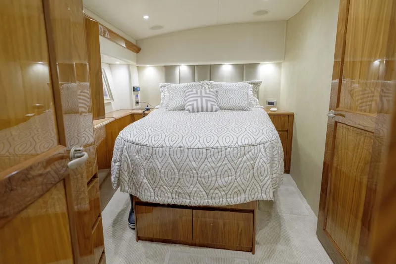 Time Away Yacht Photos Pics Luxurious bedroom interior of 2019 Viking 48 Convertible yacht with elegant bedding.