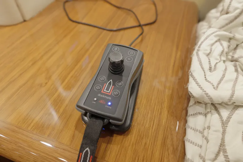 Time Away Yacht Photos Pics Remote control on wooden surface in 2019 Viking 48 Convertible yacht interior.