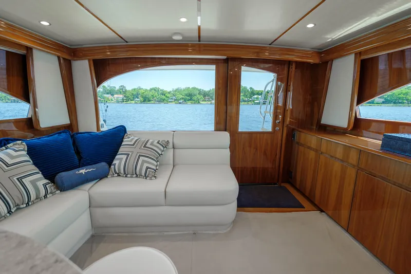 Time Away Yacht Photos Pics Luxurious interior of 2019 Viking 48 Convertible yacht with scenic water view.
