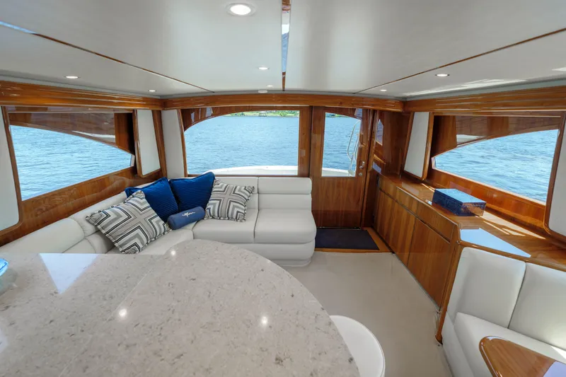 Time Away Yacht Photos Pics Luxurious interior of 2019 Viking 48 Convertible yacht with elegant seating and panoramic windows.