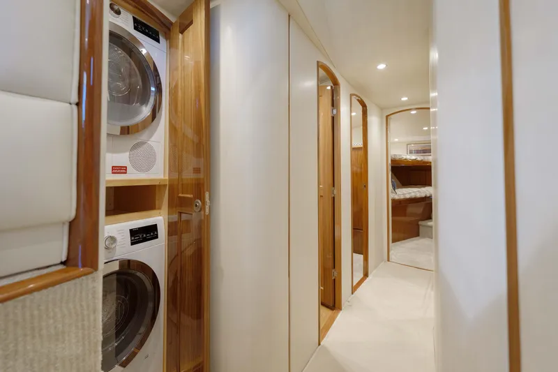 Time Away Yacht Photos Pics Interior of 2019 Viking 48 Convertible yacht with laundry appliances and hallway view.