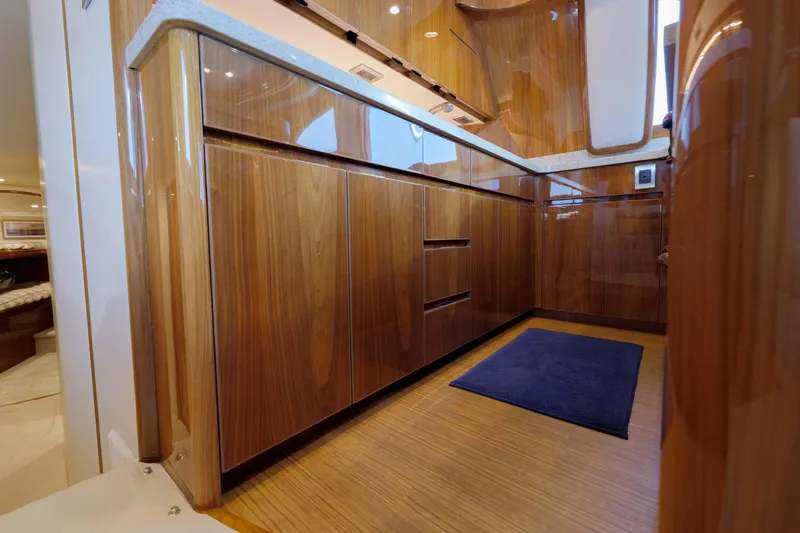 Time Away Yacht Photos Pics Luxurious wooden interior of 2019 Viking 48 Convertible yacht kitchen.