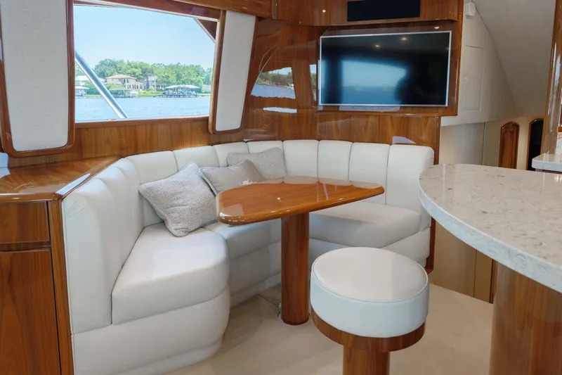 Time Away Yacht Photos Pics Luxurious interior of 2019 Viking 48 Convertible yacht with plush seating and modern decor.