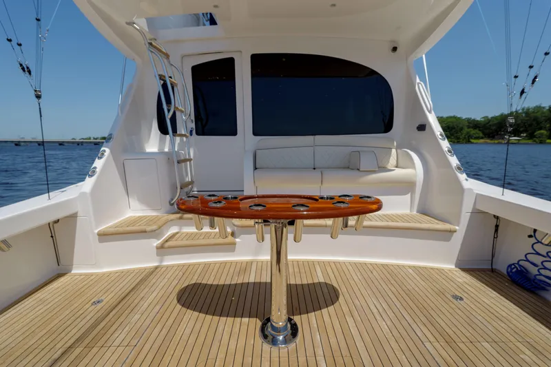 Time Away Yacht Photos Pics 2019 Viking 48 Convertible yacht deck with seating and fishing rod holders.