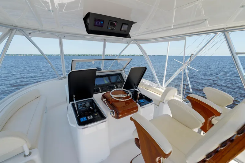 Time Away Yacht Photos Pics Helm of 2019 Viking 48 Convertible yacht with ocean view and luxurious seating.