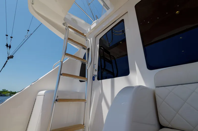 Time Away Yacht Photos Pics 2019 Viking 48 Convertible yacht with ladder and seating, exterior view.