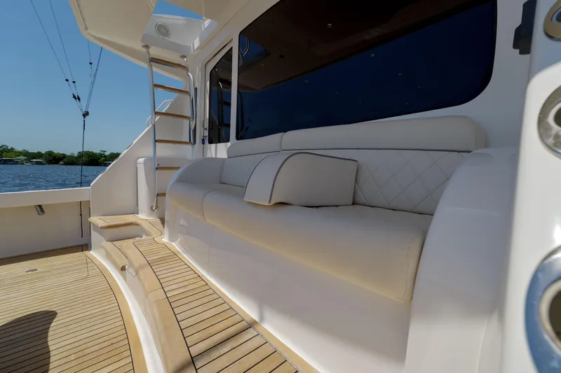 Time Away Yacht Photos Pics Luxurious seating on 2019 Viking 48 Convertible yacht with teak deck and elegant design.