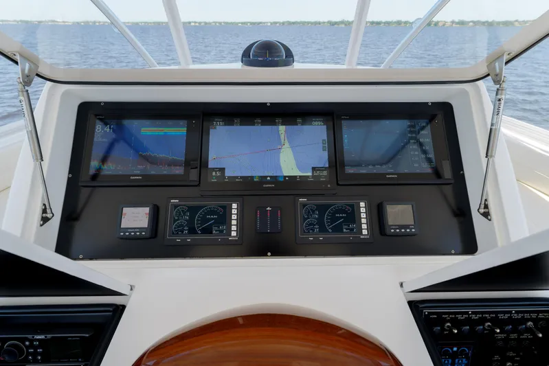 Time Away Yacht Photos Pics 2019 Viking 48 Convertible yacht dashboard with advanced navigation displays on open water.