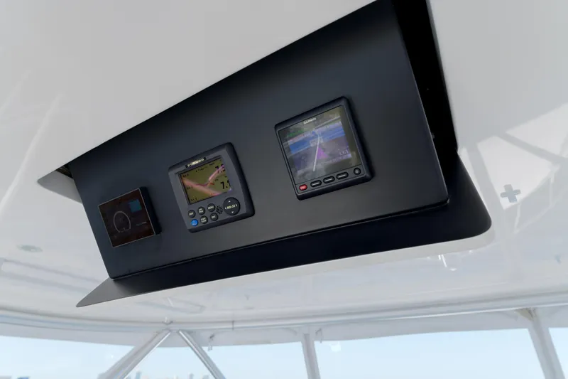 Time Away Yacht Photos Pics Control panel of 2019 Viking 48 Convertible yacht with navigation displays.