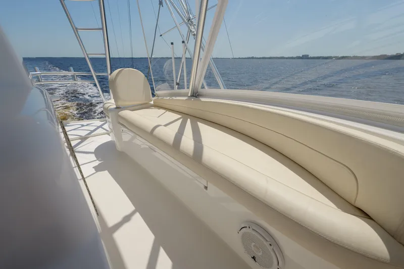 Time Away Yacht Photos Pics 2019 Viking 48 Convertible yacht with beige seating, cruising on open water.